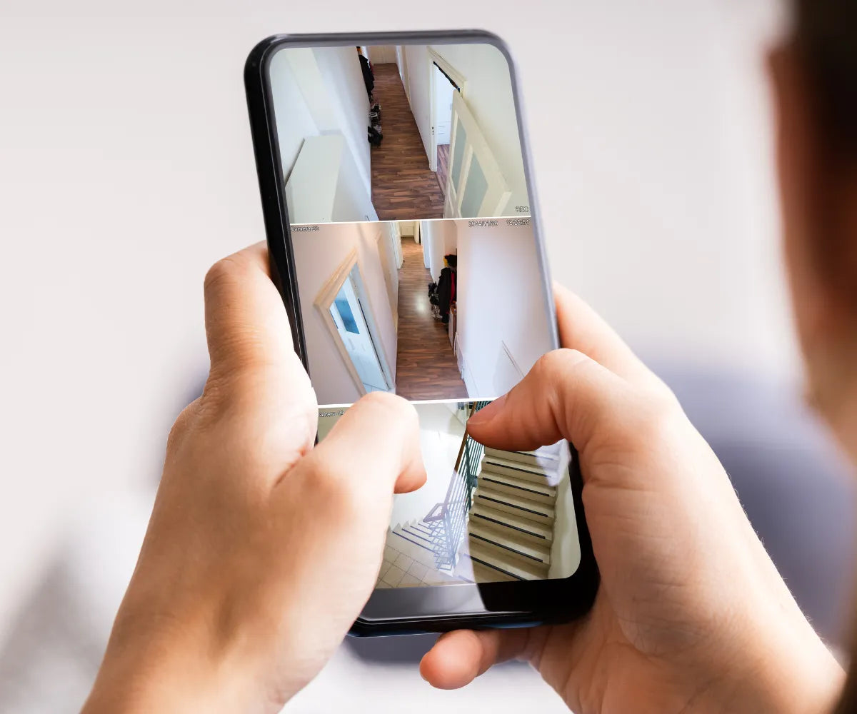 Person Checking Home Cameras From Phone