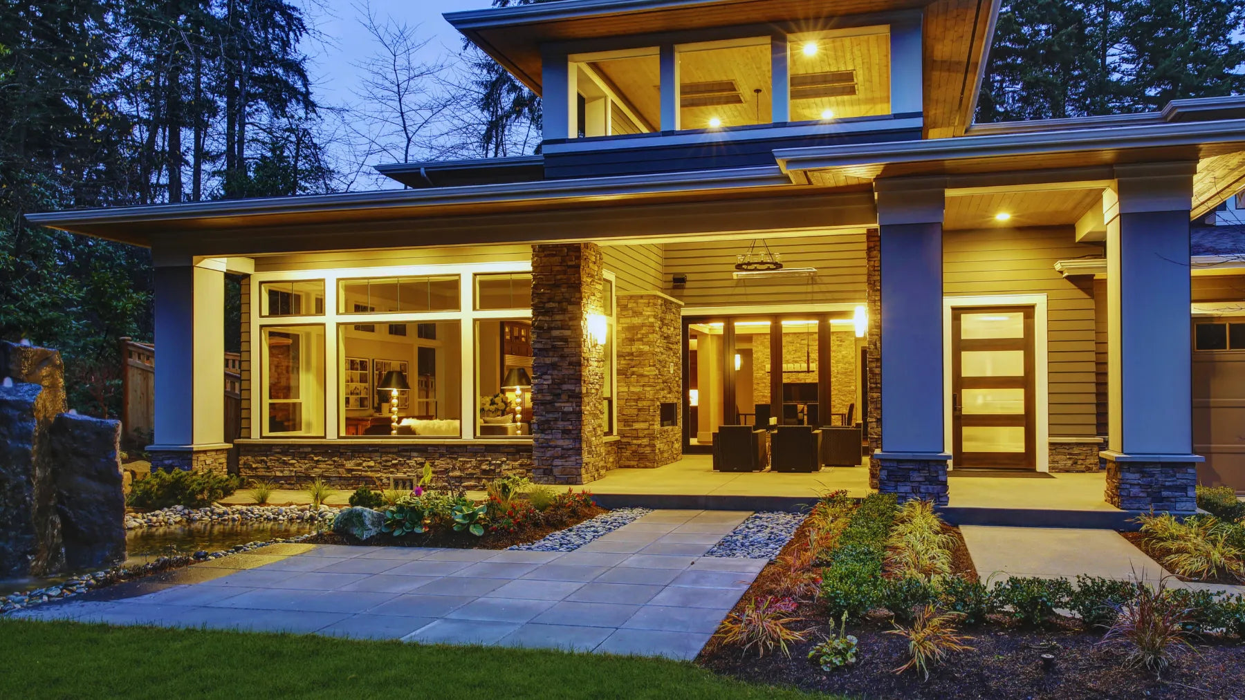 Beautiful Modern House At Sunset with Outdoor Lights On